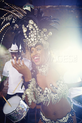 Buy stock photo Dancer, night or happy woman in carnival in a performance, smile or culture in an event or band. Music, samba or excited people dancing at party for celebration with drums in Rio de Janeiro, Brazil