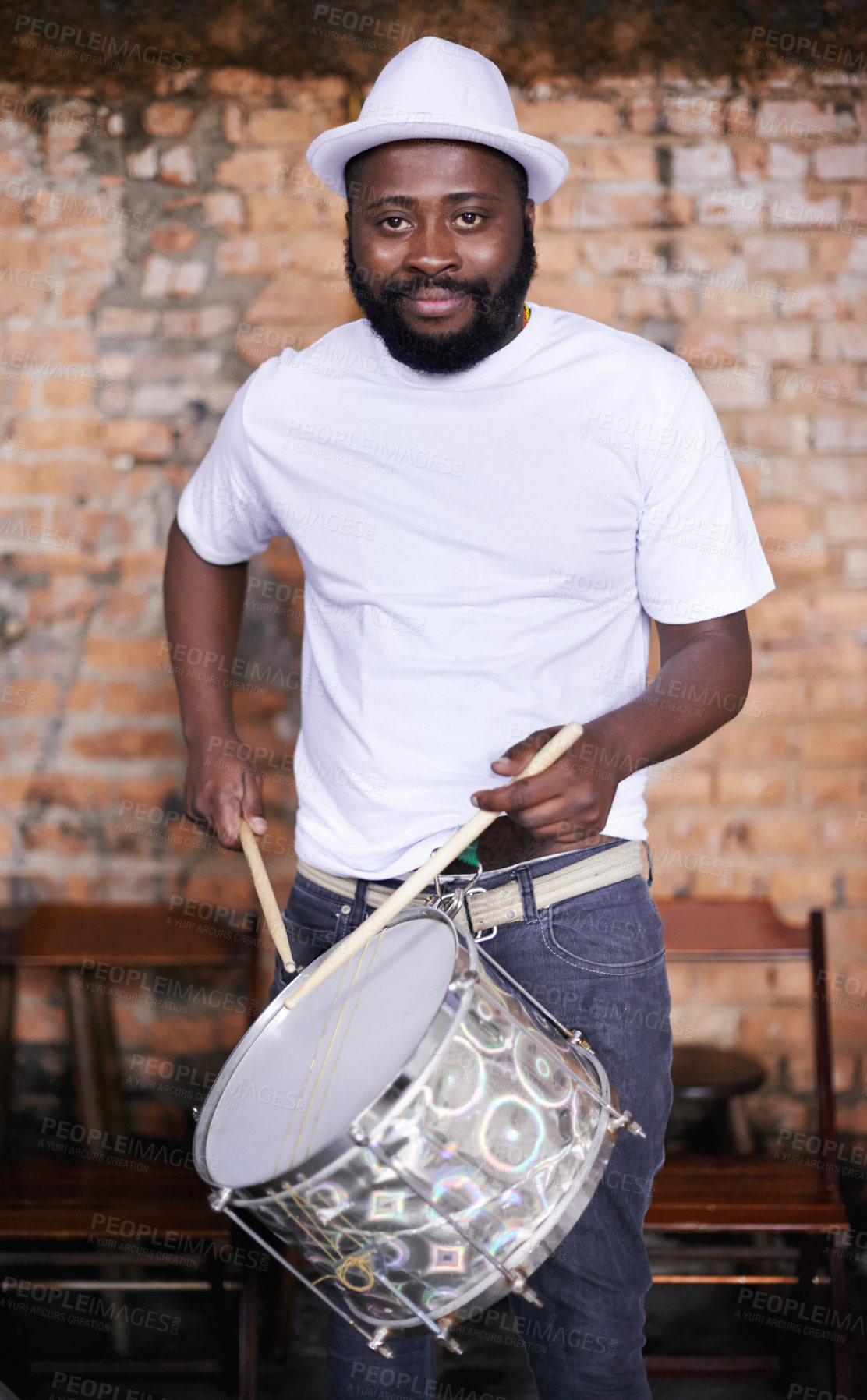 Buy stock photo Portrait, drums or carnival with a black man playing an instrument in a festival in Rio de Janeiro. Brazil, ready or party with a male musician, performer or artist banging on a drum to create a beat