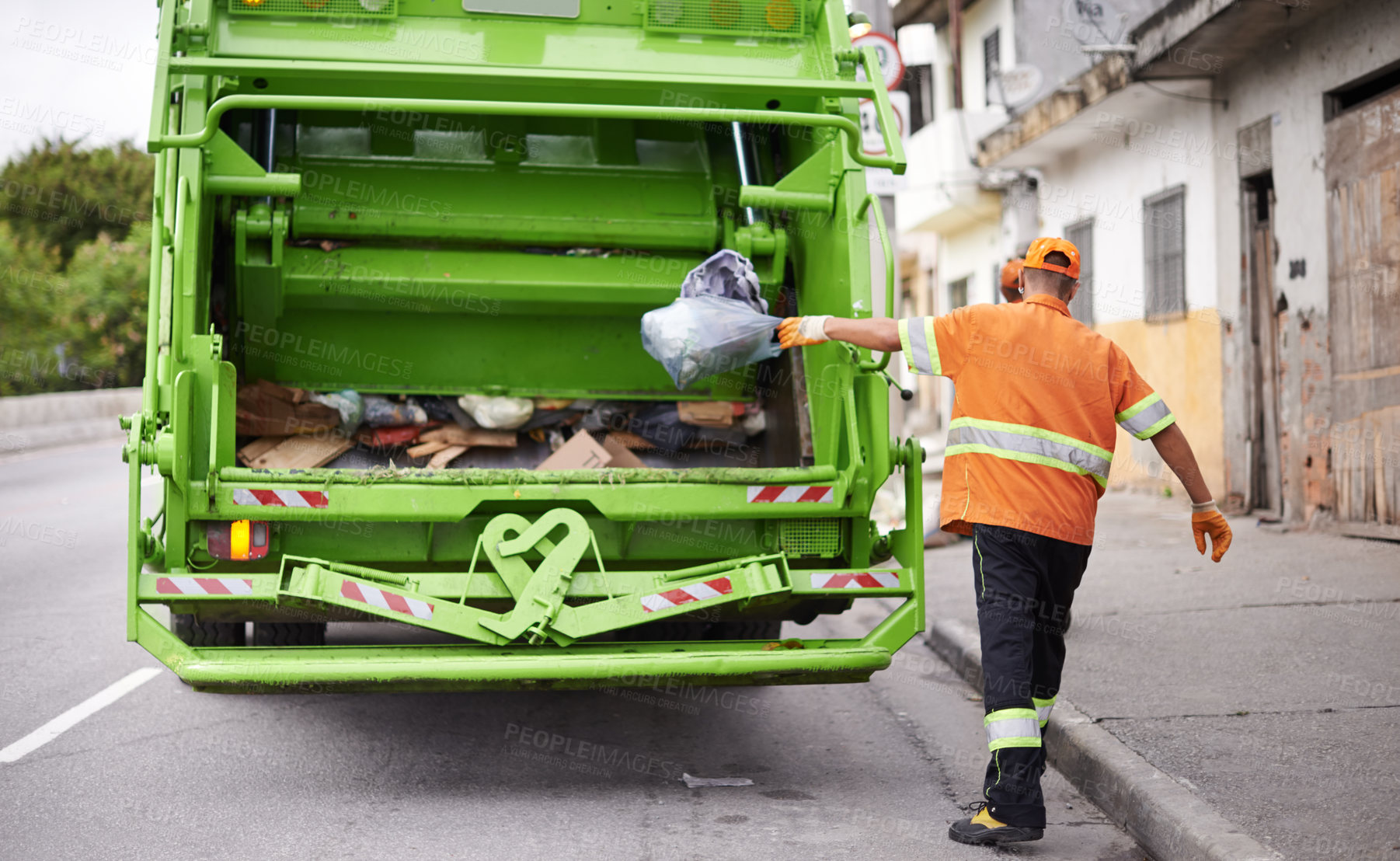 Buy stock photo Waste, truck and man with garbage, collection and recycling in the community, city and clean. Back, male employee and trash collector with vehicle, street and service with rubbish and sanitation