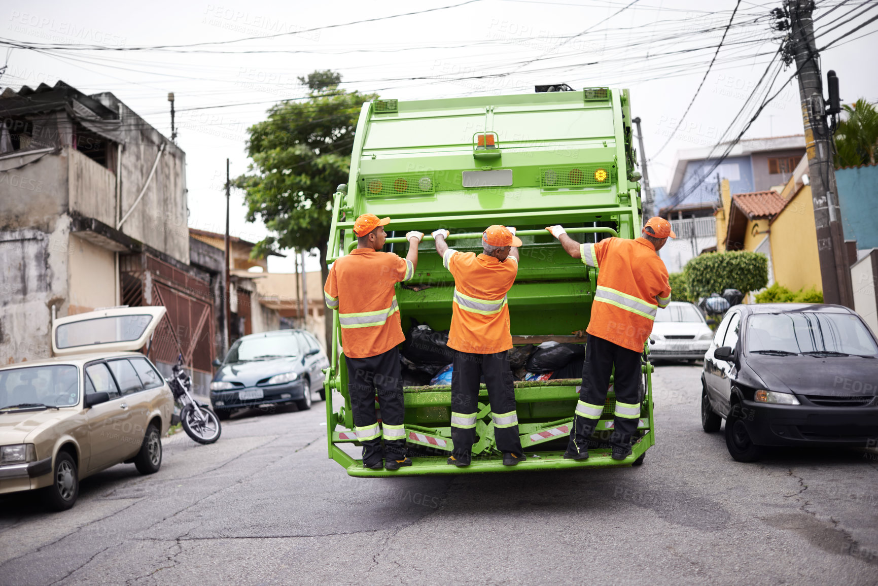 Buy stock photo Industry, waste management and garbage truck with men in uniform cleaning outdoor on city street. Job, service and male people working with rubbish for sanitation, maintenance or collection of dirt.