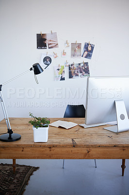 Buy stock photo Empty office, computer desk and small business startup of interior or online marketing studio. Photo wall with desktop PC and notebook with lamp on table for creativity in a clean modern workspace