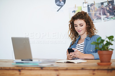 Buy stock photo Woman, designer and texting on smartphone in creative startup, photography agency and office desk. Young business student typing on cellphone, online app and reading notification on mobile technology