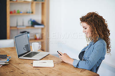 Buy stock photo Happy woman, business student and texting on smartphone in creative startup, designer agency or desk. Young office intern typing on cellphone, online app or reading notification on mobile technology