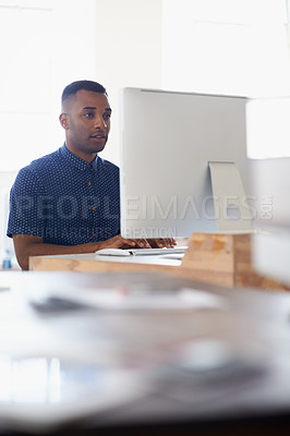 Buy stock photo Journalist, office or black man with computer to research news, online business or digital project. Focus, database or serious employee writing blog reports or internet article on pc or laptop desk