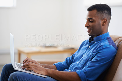 Buy stock photo Man, laptop and online for remote work at home, freelancer and copywriting in living room. Black male person, happy and plan on tech or connection for website, journalist and research for article