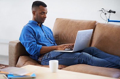 Buy stock photo Man, laptop and typing for remote work at home, freelancer and copywriting in living room. Black male person, online and plan on tech or connection for website, information and research for article