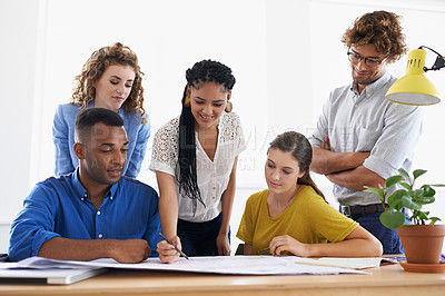 Buy stock photo Diversity, business people and writing on documents in teamwork planning, strategy or collaboration at the office. Group of diverse employees working on paperwork in team brainstorming at workplace