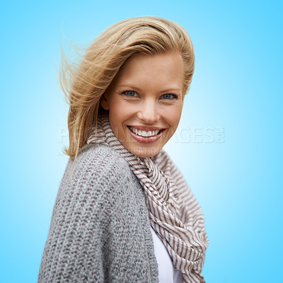 Buy stock photo Autumn, fashion and portrait of happy woman in studio, blue background or mock up space. Casual, style and girl with beauty from makeup, cosmetics or positive attitude in cardigan, jersey and scarf