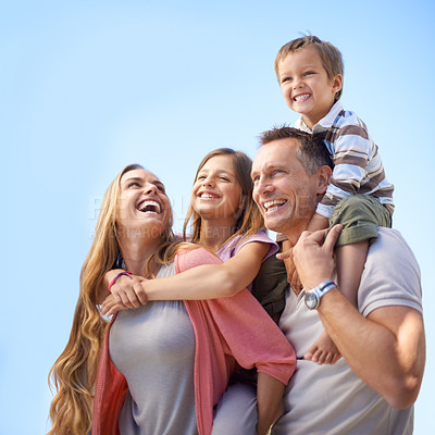 Buy stock photo A happy family of four having fun while on holiday
