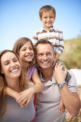 Buy stock photo Portrait of a happy family of four having fun while on holiday