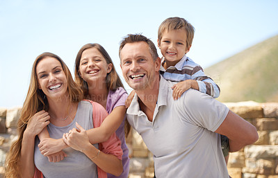 Buy stock photo Portrait of a family looking happy while on holiday