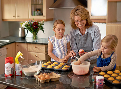 Buy stock photo Grandmother, children and baking cupcakes or teaching with icing decorations or learning creativity, bonding or teamwork. Woman, siblings and sweet treats or helping with ingredients, snack or recipe