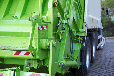 Buy stock photo Rear view shot of garbage truck at work