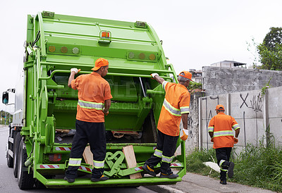 Buy stock photo Cropped shot of a team of garbage collectors