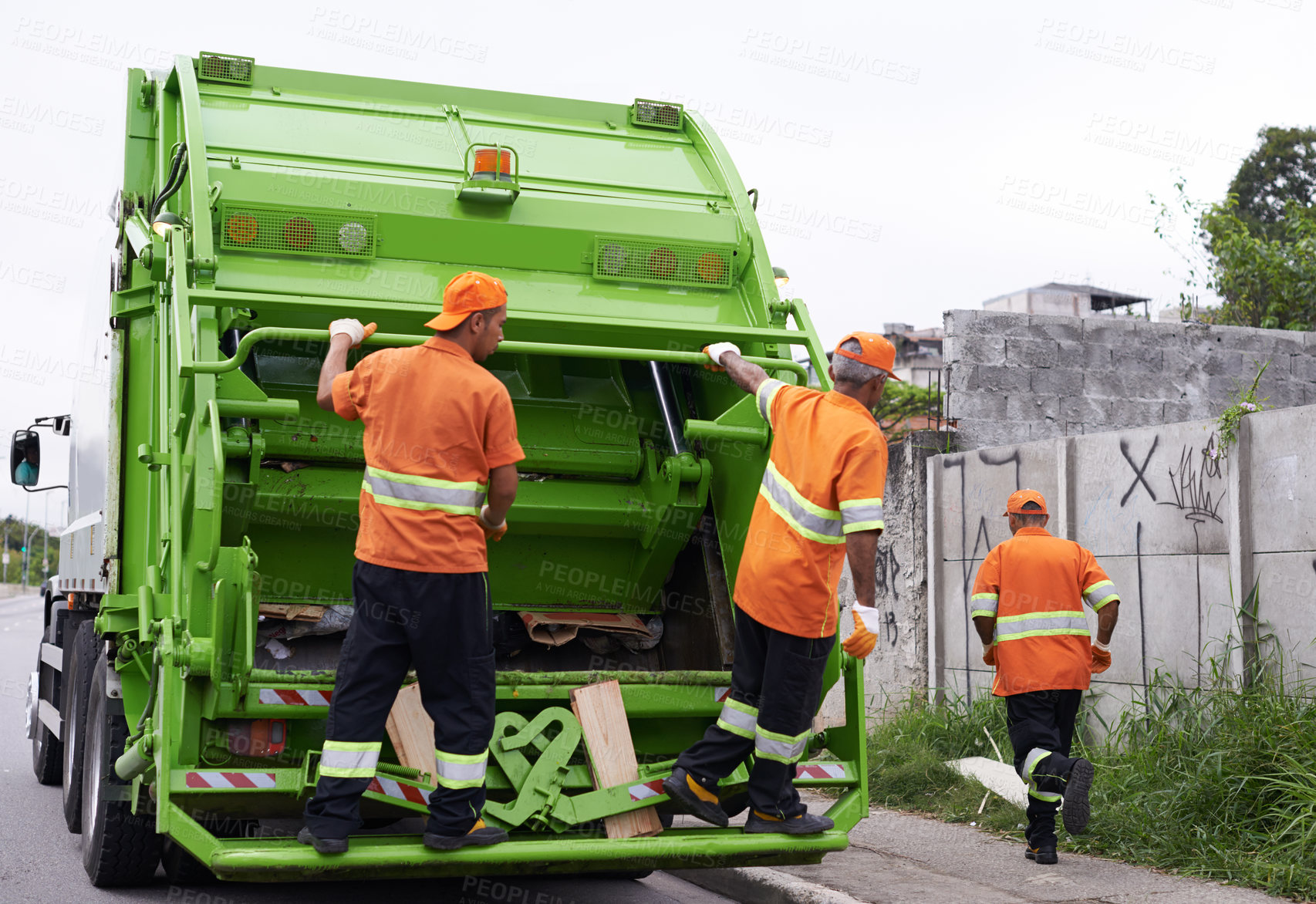 Buy stock photo Cropped shot of a team of garbage collectors