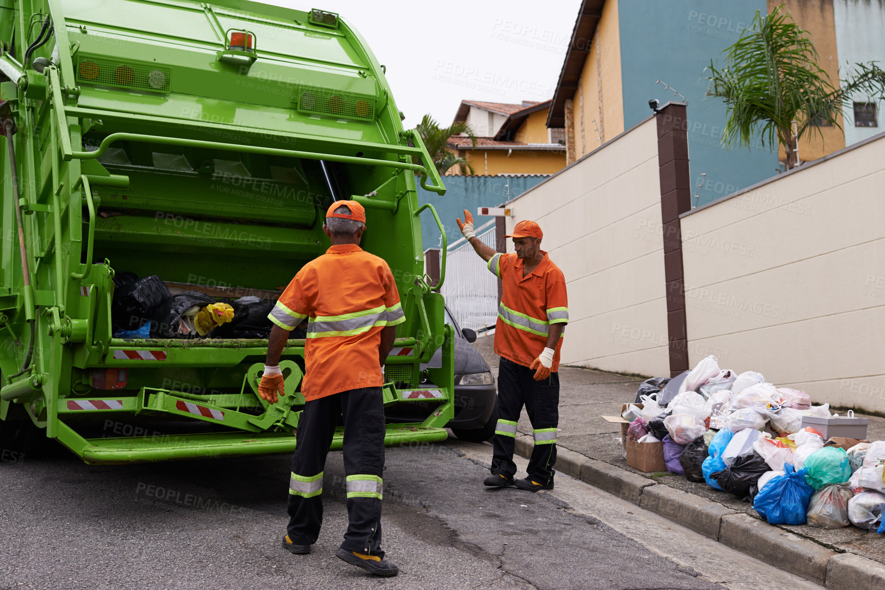 Buy stock photo Trash, people and working with garbage truck for waste management, service and maintenance. Urban, cleaning and men outdoor with industrial sanitation, collection of rubbish and infrastructure