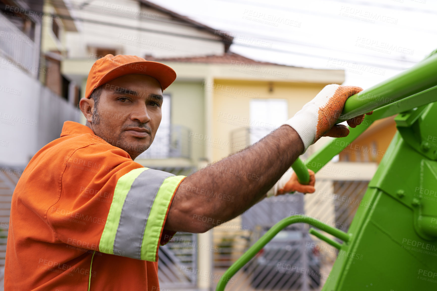 Buy stock photo Cropped shot of a male worker on garbage day