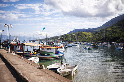 Buy stock photo A shot of fishing boats in the harbour