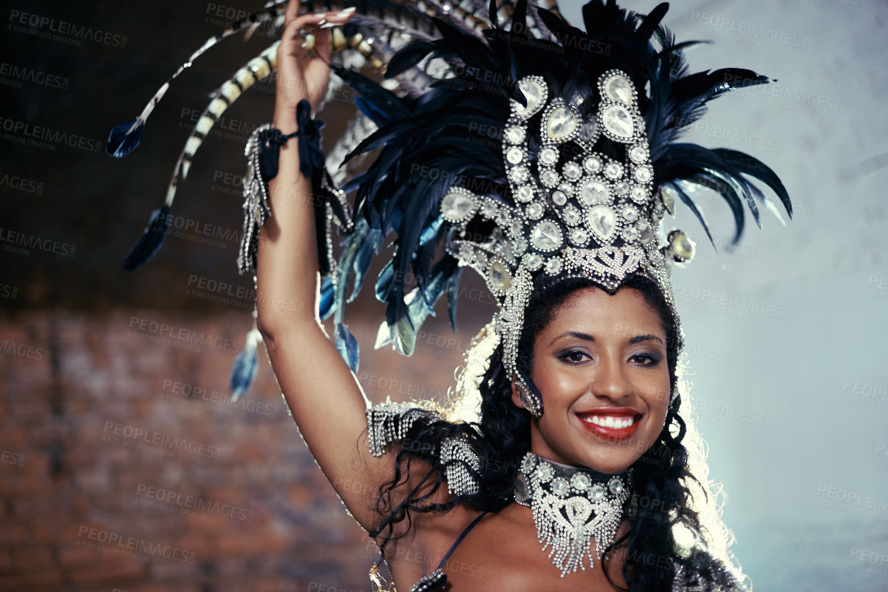 Buy stock photo Portrait, samba dancer and black woman with headdress for carnival, festival or parade on urban background in Rio de Janeiro. Brazilian performer, female person and closeup in costume for performance