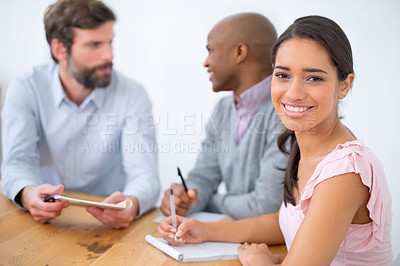 Buy stock photo Portrait, smile and business woman writing notes in meeting with professional team at startup together. Face, happy and creative entrepreneur at table with group, coworking and copywriter with book