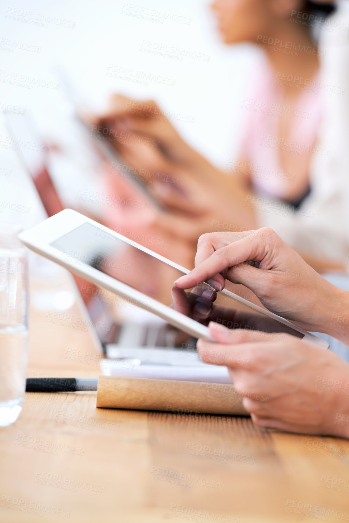 Buy stock photo Hands, tablet and business person closeup in meeting for conference, networking or communication online. Desk, scroll and digital technology for planning, research and designer at creative startup