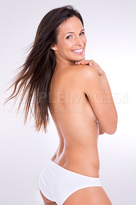 Buy stock photo Nude, happy and a portrait of a woman in underwear isolated on a white background in a studio. Smile, sexy and a beautiful model with happiness for naked glow, covering body and smiling on a backdrop