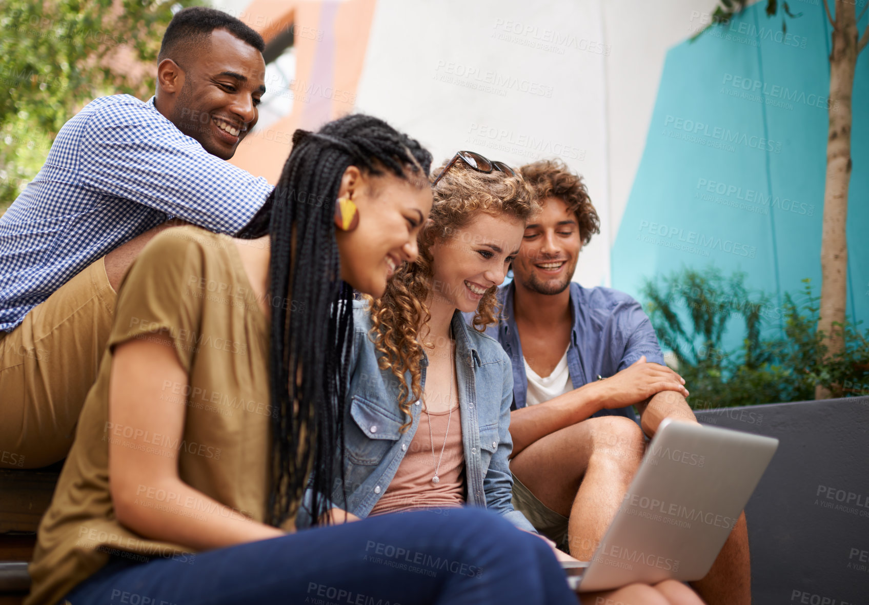 Buy stock photo Laptop, scholarship and group of friends on university or college campus together for learning or study. Computer, smile or school education with happy young man and woman students on academy stairs