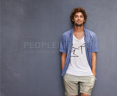 Buy stock photo Confidence, casual and male model by a wall with mockup space with a hipster, cool and stylish outfit. Happy, positive and handsome man with trendy style or fashion by a gray background with mock up.