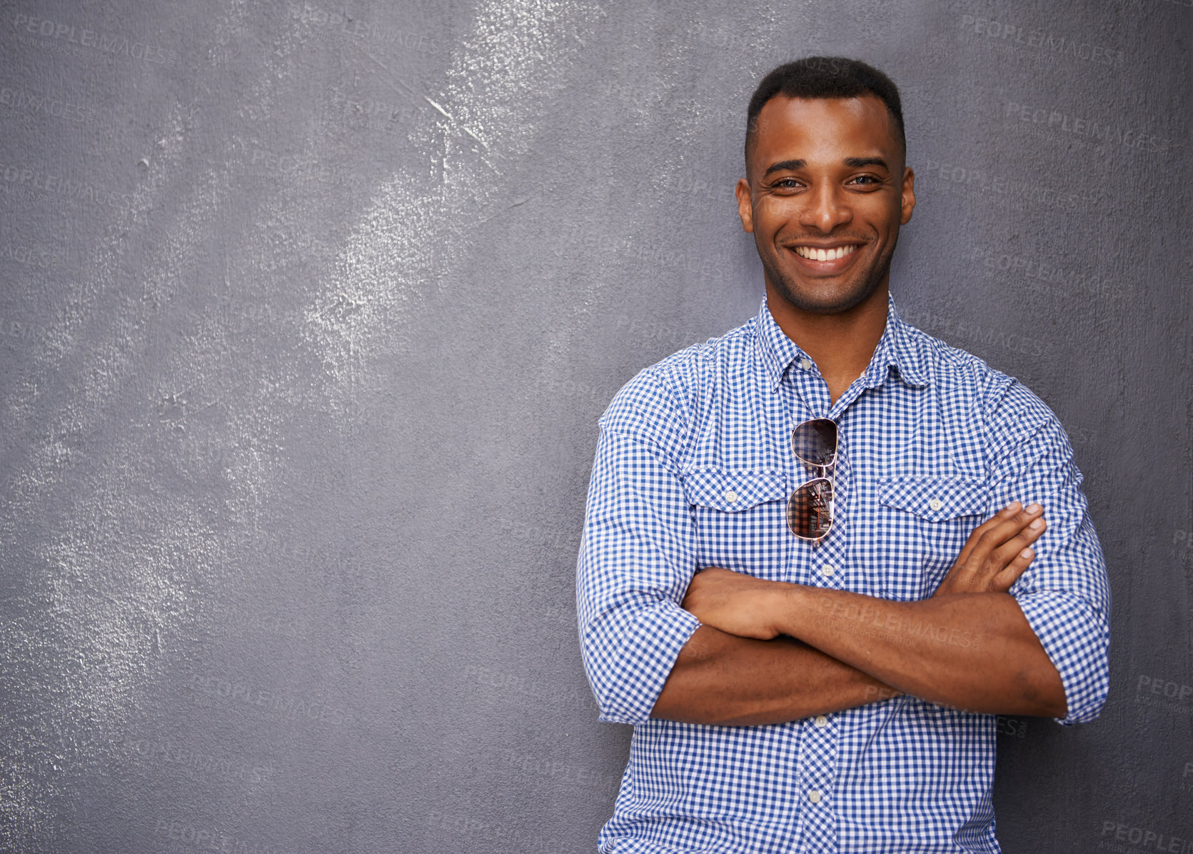 Buy stock photo Man, smile and fashion or style in portrait by wall background, cool outfit and mockup space. Happy black male person, university student and outdoors for aesthetic, confident and trendy clothes