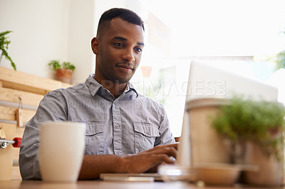 Buy stock photo Black man, typing and laptop for remote work from cafe, restaurant and coffee shop in creative career. African male person, writer or freelancer for media website, social networks or blogging