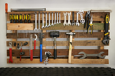 Buy stock photo Shot of a tools hanging on a wall