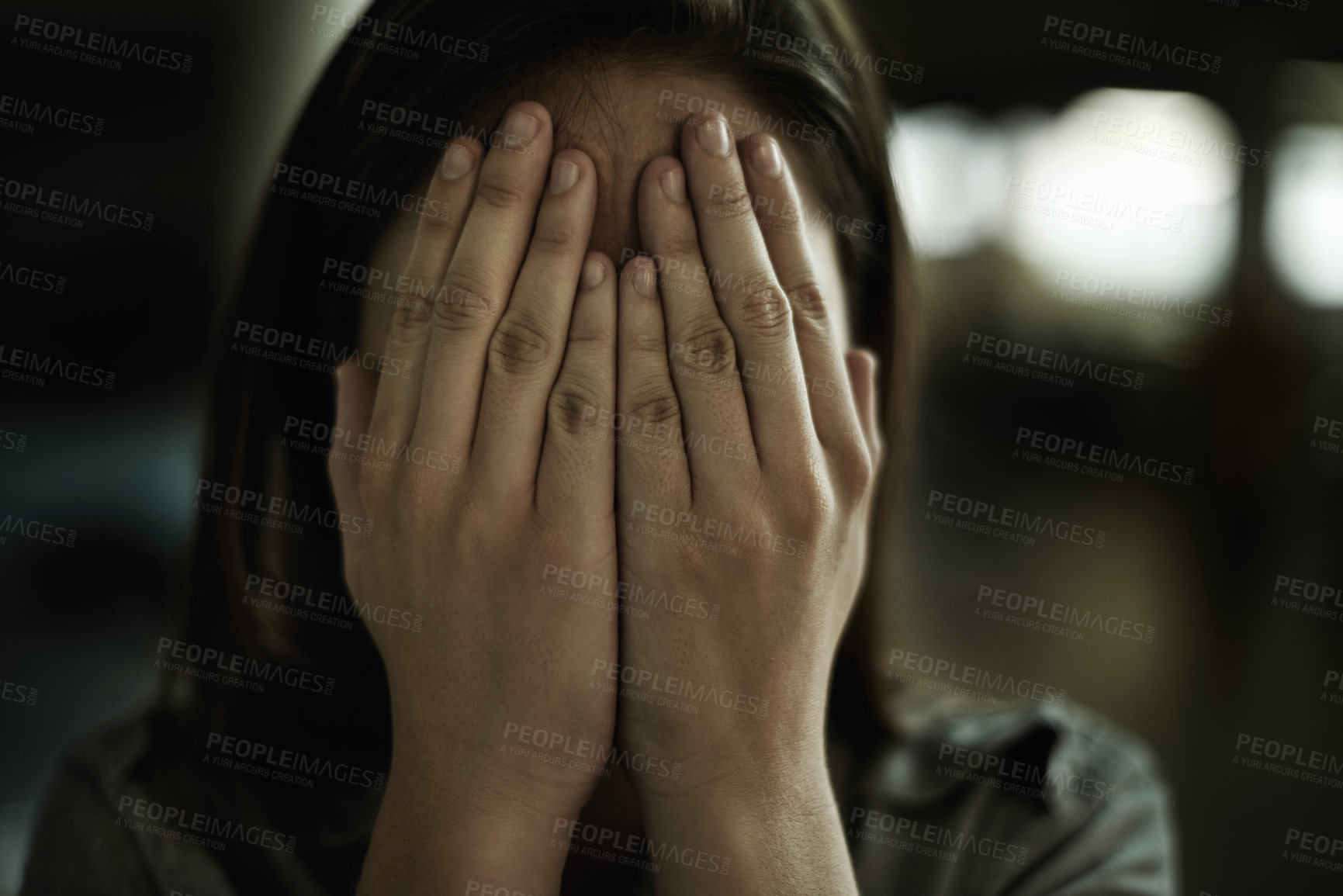 Buy stock photo Anxiety, horror and hands on face of woman to cover reaction from fear, panic or terror closeup. Stress, depression and mental health with scared young person hiding from danger, drama or violence