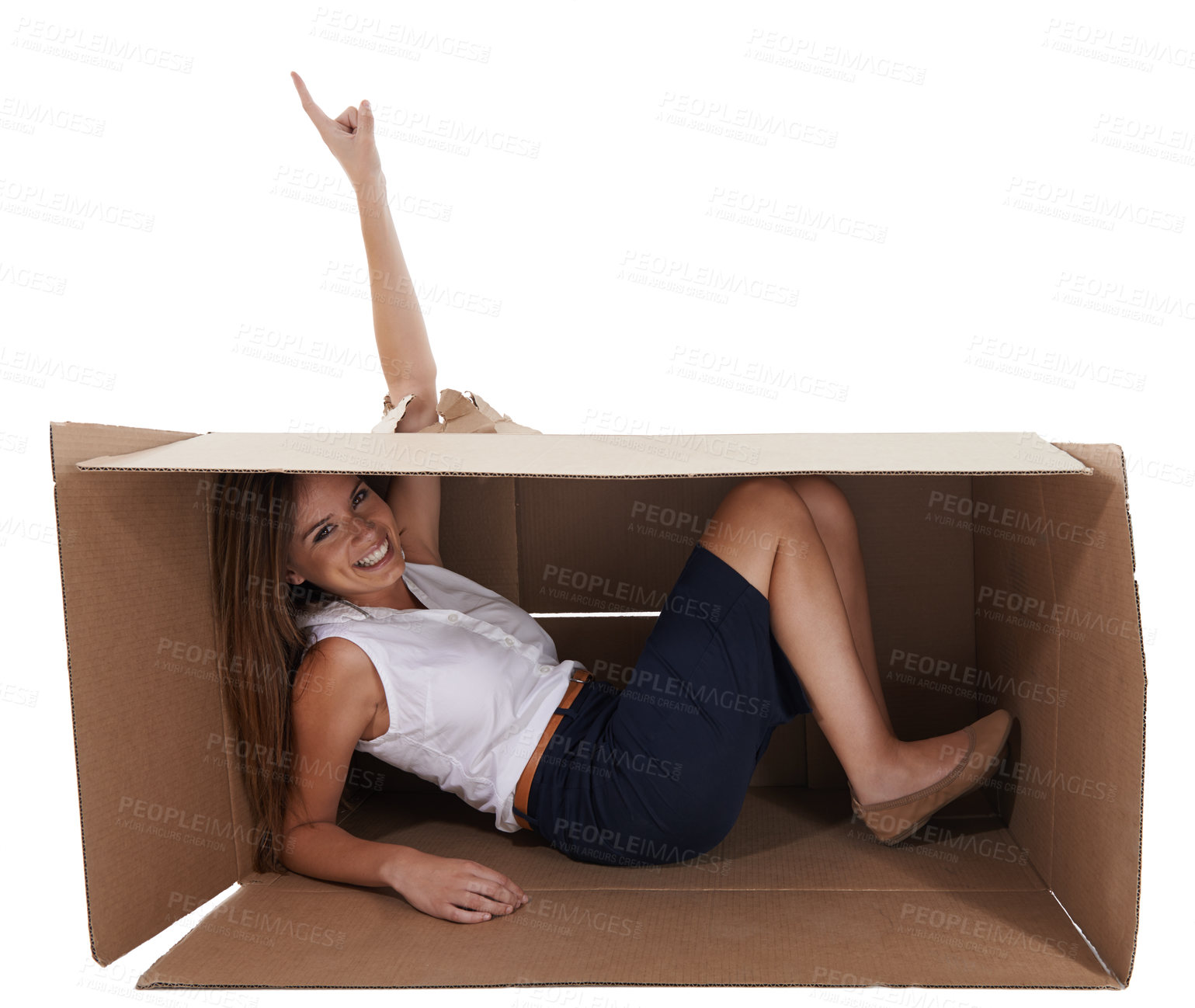 Buy stock photo Portrait, space and pointing with woman in box for studio marketing, isolated or white background for advertising. Smile, hole and hand gesture for breakthrough with happy young person showing mockup