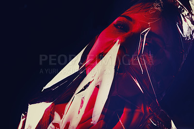 Buy stock photo Scary, woman and bag on face with plastic in drama on studio, dark background or afraid of death. Suffocation, murder and girl with fear from crime, victim and trapped in trash, garbage or pollution