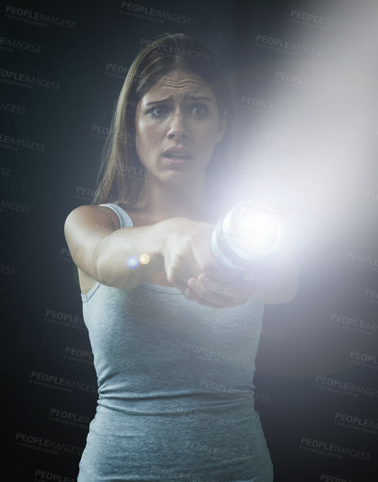 Buy stock photo Woman, fear and horror or flashlight for search in studio, anxiety and stress for risk in mystery. Female person, nervous and lamp in dark against black background, caution and danger on halloween