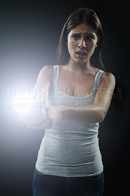 Buy stock photo Woman, fear and scared or flashlight for search in studio, anxiety and stress for risk in mystery. Female person, nervous and lamp in dark against black background, caution and danger on halloween
