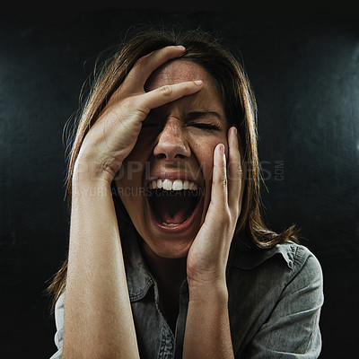 Buy stock photo Face, stress and horror with woman screaming in studio on black background for reaction to fear. Phobia, anxiety and mental health with scared young person in dark for drama, nightmare or terror