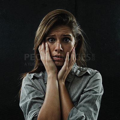Buy stock photo Portrait, stress and horror with phobia woman in studio on black background for reaction to fear. Face, anxiety and mental health with scared young person in dark for drama, nightmare or terror