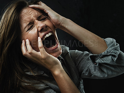 Buy stock photo Face, stress and horror with woman yelling in studio on black background for reaction to fear. Phobia, mental health and breakdown with scared young person in dark for drama, nightmare or terror