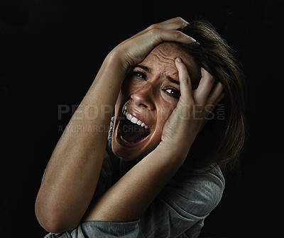 Buy stock photo Portrait, horror and fear with woman screaming in studio on black background for reaction to danger. Face, stress and mental health with scared young person in dark for phobia, nightmare or terror