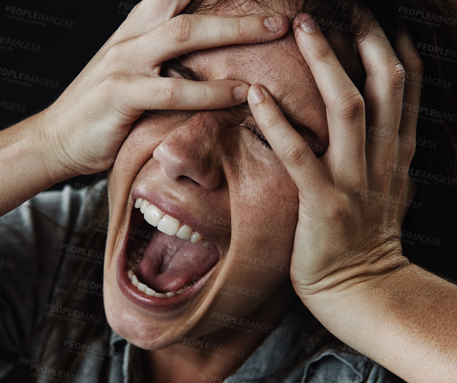 Buy stock photo Face, horror and phobia with woman screaming in studio on black background for reaction to fear. Anxiety, mental health and shouting with scared young person in dark for stress, nightmare or terror