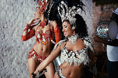 Buy stock photo Samba, carnival and women in costume together for celebration, music culture and happy band in Brazil. Dance, party and girl friends with smile at festival, parade or stage show in Rio de Janeiro
