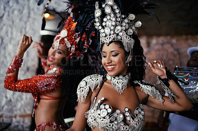 Buy stock photo Samba, festival and women in costume together for celebration, music culture and happy band in Brazil. Dance, party and girl friends with smile at carnival, parade or stage show in Rio de Janeiro