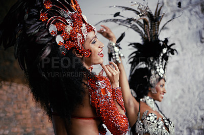Buy stock photo Shot of two beautiful samba dancers performing in a carnival