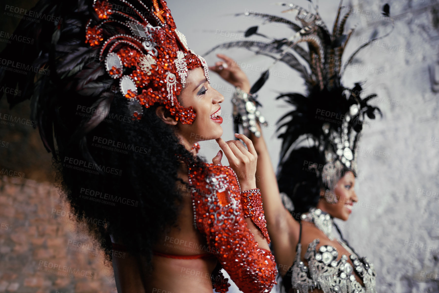 Buy stock photo Shot of two beautiful samba dancers performing in a carnival