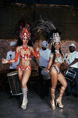 Buy stock photo Portrait, samba and women at carnival in costume for celebration, music culture and happy band in Brazil. Dance, party and girl friends together at festival, parade or stage show in Rio de Janeiro