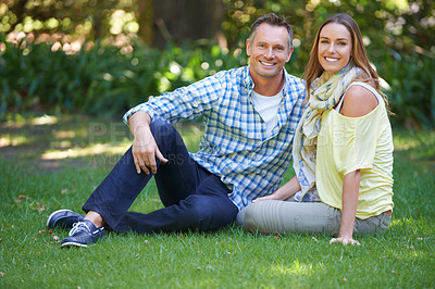 Buy stock photo Portrait, relax and couple with smile on grass for summer romance, trees and fun outdoor date. Love, mature man and happy woman in garden with morning sunshine, park and marriage bonding in nature.