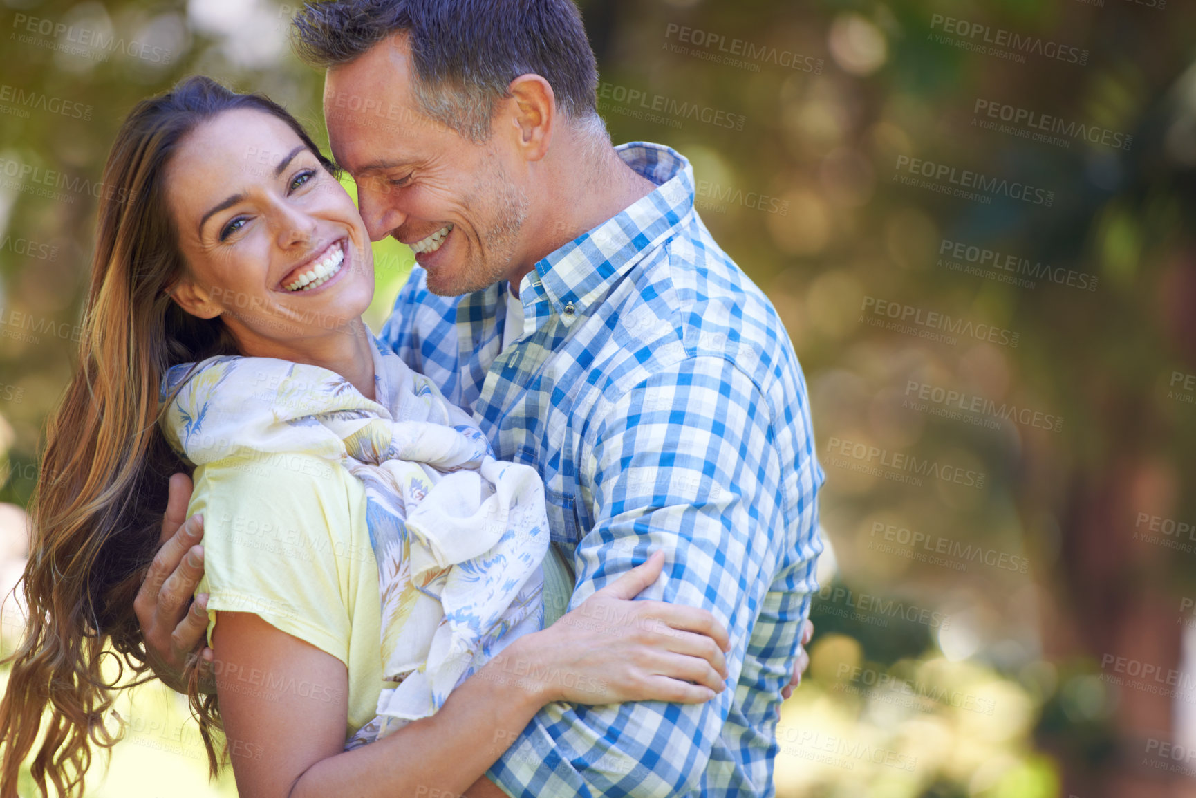 Buy stock photo Couple, portrait and bonding with love in garden together, hug and romance for relationship with commitment. Man, woman and affection for dating with care, happy and spouse for comfort in nature