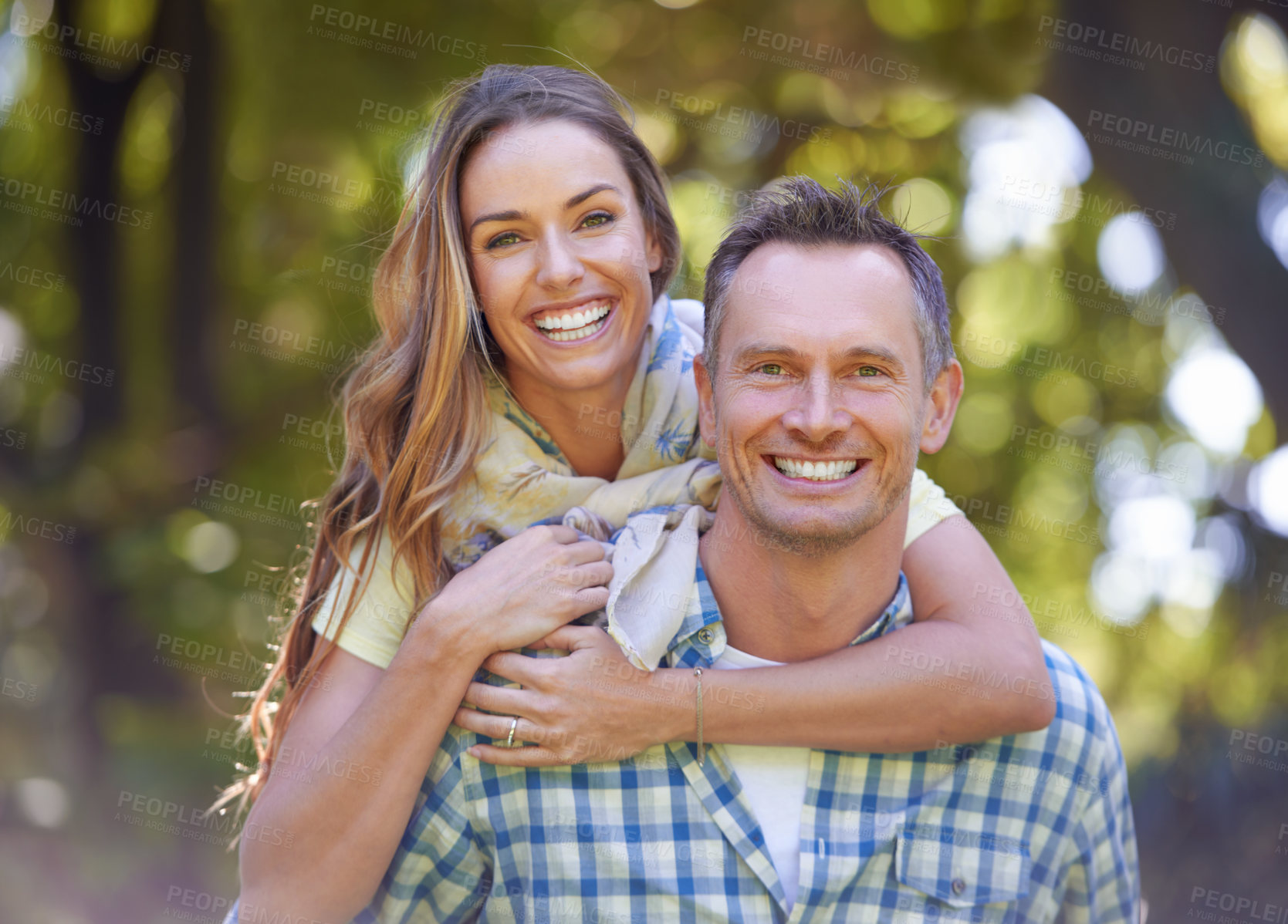 Buy stock photo Portrait, embrace and couple with smile in park for summer romance, trees and fun outdoor date. Love, mature man and happy woman in garden with morning sunshine, hug and marriage bonding in nature.