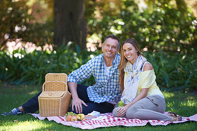 Buy stock photo Portrait, picnic and couple with love, basket and happiness with romance and Valentines day with marriage. Date, man and woman on the ground, relationship or anniversary with celebration or honeymoon